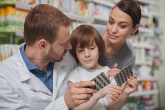 Pharmacist recommending products to a mother and child